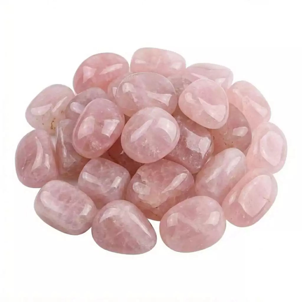 Collection of polished rose quartz tumbled stones in assorted sizes — soft pink heart chakra crystals for bulk crystal grids, altars, and self-care rituals.