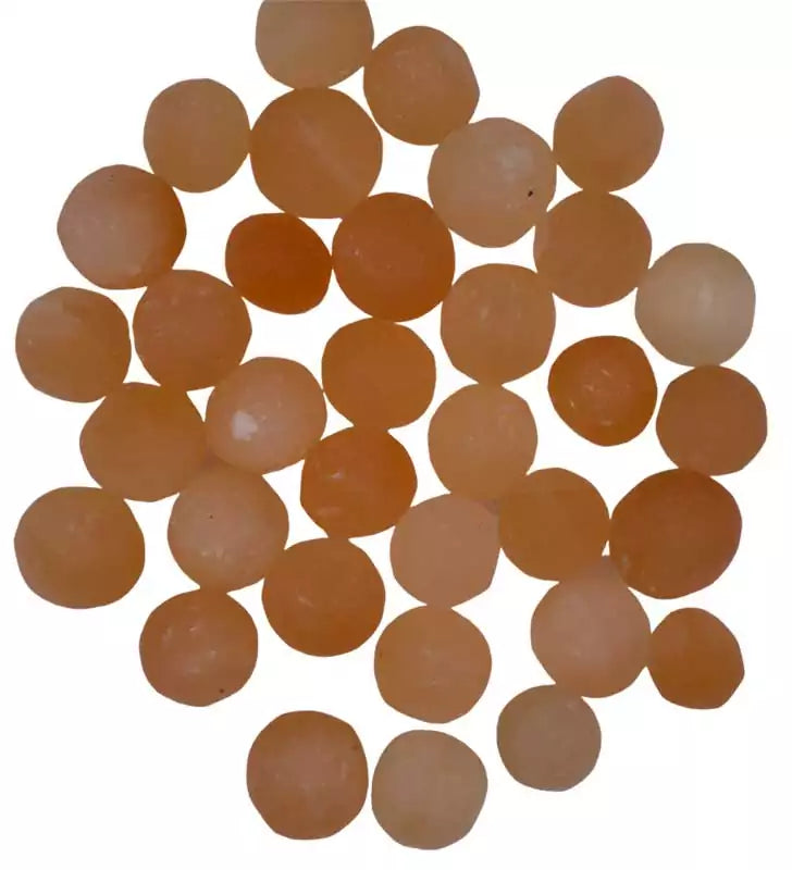 One pound bulk lot of orange (peach) selenite tumbled stones in warm tones — sacral chakra crystal for creativity and energy clearing work.