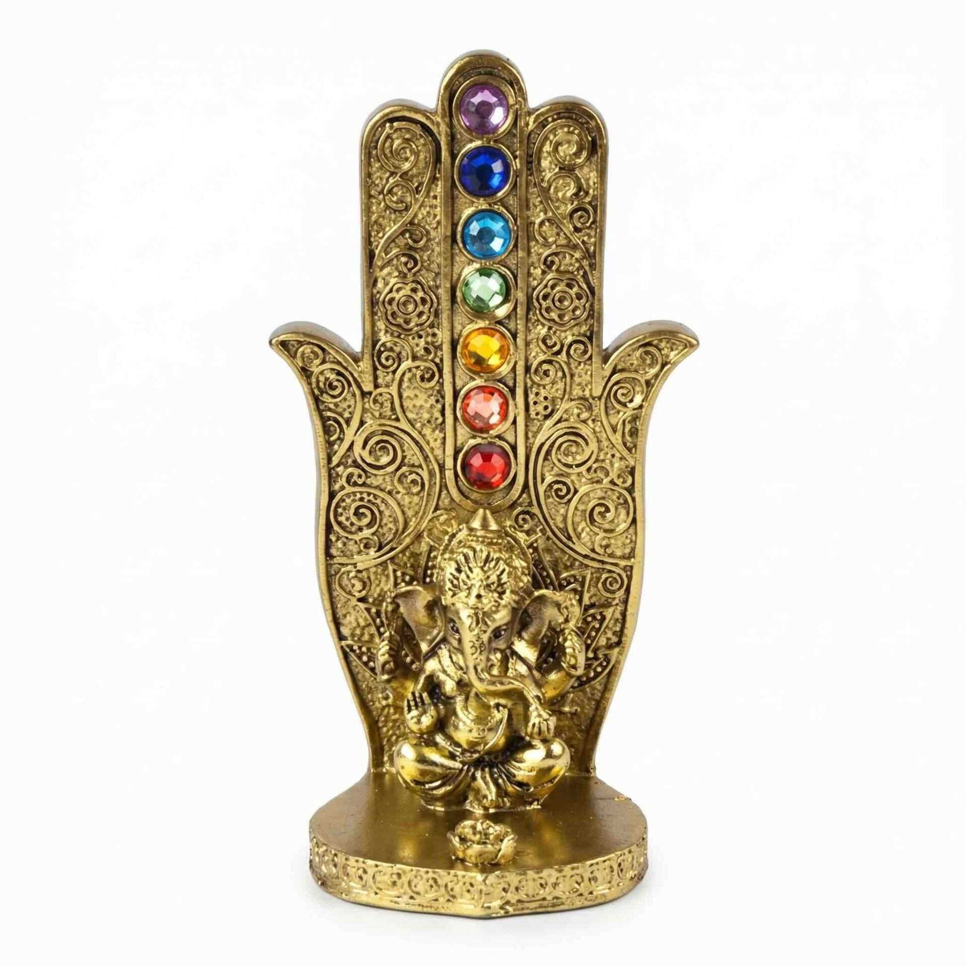 Gold-tone decorative hand incense burner with colorful chakra gemstones along the center and a small Ganesha figurine at the base.