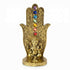Gold-tone decorative hand incense burner with colorful chakra gemstones along the center and a small Ganesha figurine at the base.