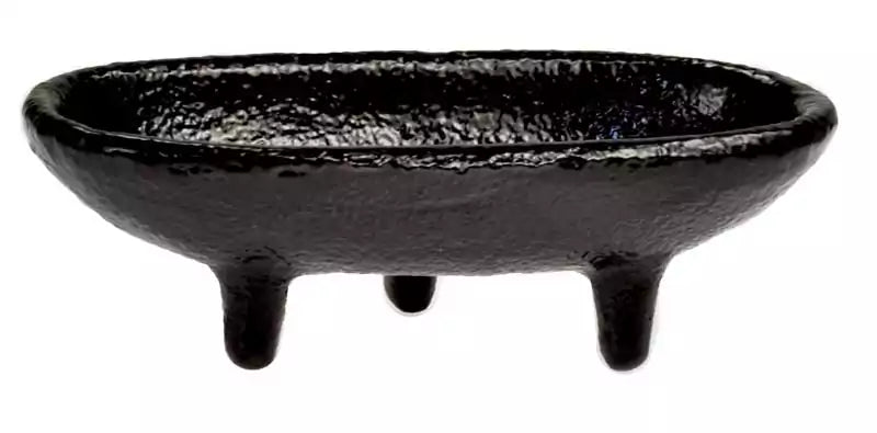4-inch gloss black cast iron cauldron incense burner in a canoe shape with three short legs for stable altar use.