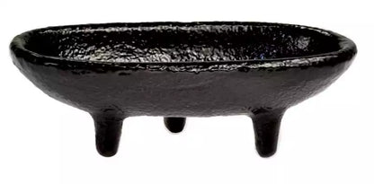 4-inch gloss black cast iron cauldron incense burner in a canoe shape with three short legs for stable altar use.