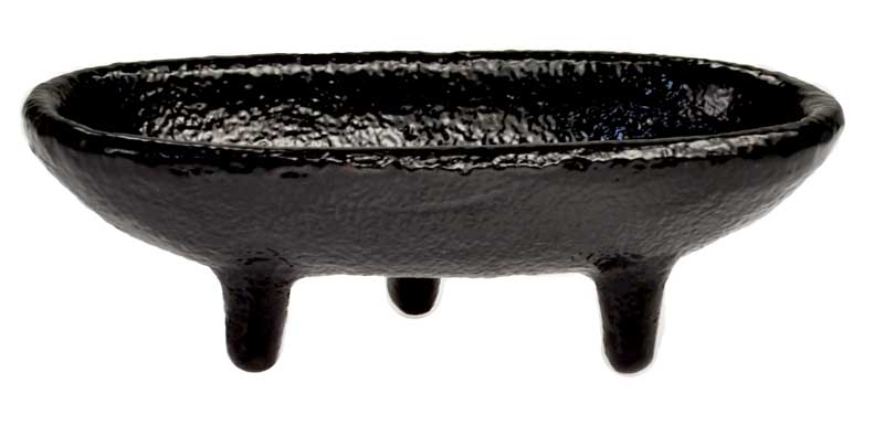 4-inch gloss black cast iron cauldron incense burner in a canoe shape with three short legs for stable altar use.