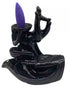 5-inch Hand of Compassion Hamsa-shaped ceramic backflow incense burner — showing cascading waterfall smoke effect for meditation and altar use.