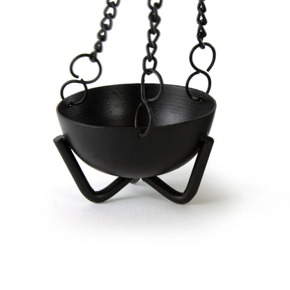 Black hanging iron incense bowl supported by chain and a tripod stand — shown in clean product photo.