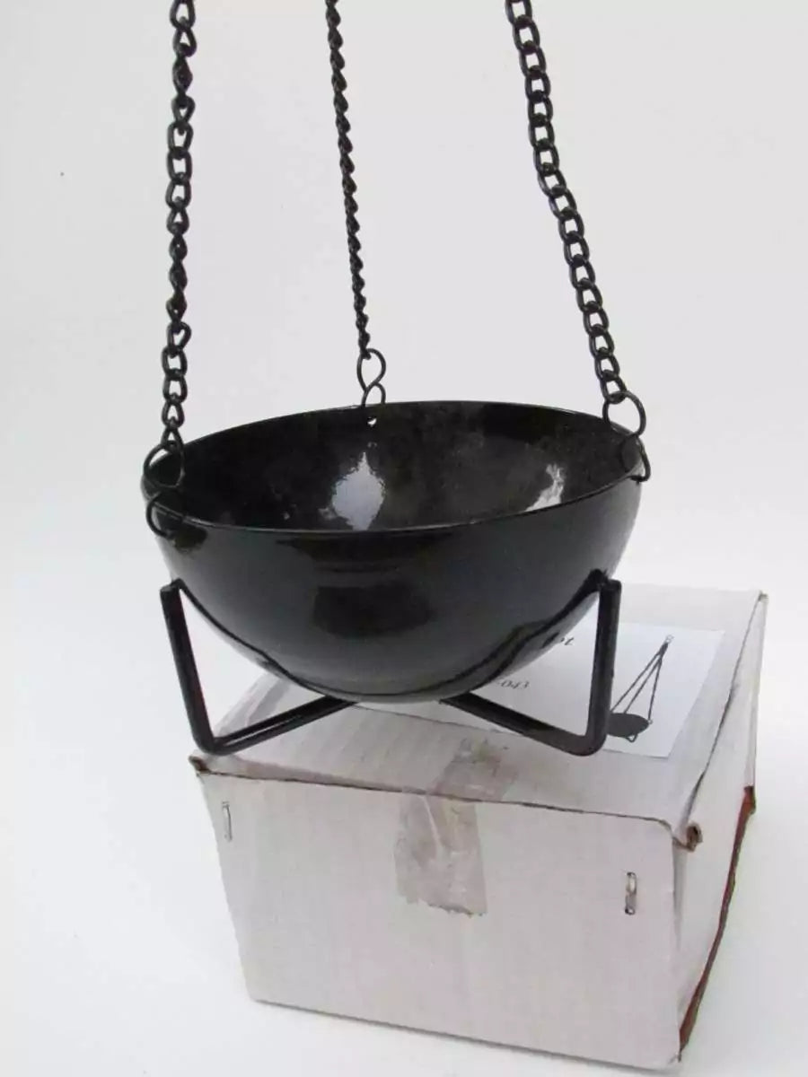 3.5-inch black cast iron hanging cauldron incense burner suspended by chains over a white box for scale.
