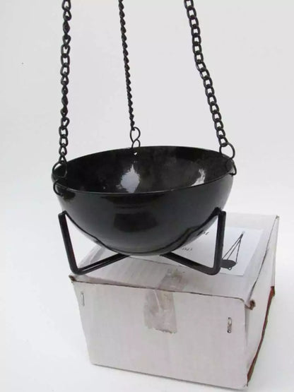 3.5-inch black cast iron hanging cauldron incense burner suspended by chains over a white box for scale.