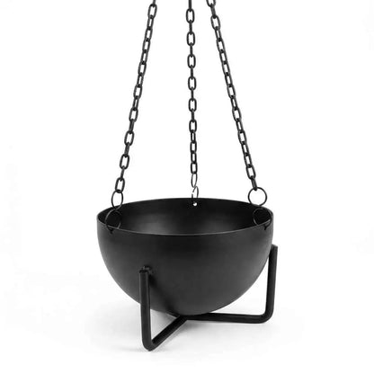 3.5-inch black cast iron cauldron hanging incense burner suspended by three chains, resting on a sturdy iron tripod base.