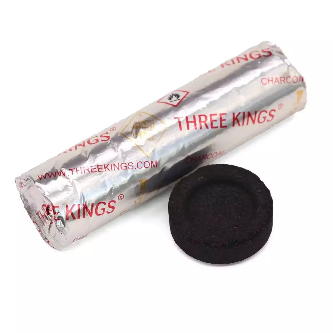Roll of Three Kings charcoal wrapped in silver foil beside a single round black quick-light charcoal disc showing the 33mm format.