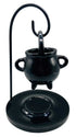 Hanging metal cauldron oil diffuser in black with perforated Gothic design — suspended on chains for ritual aromatherapy and incense burning.