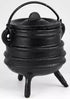 Small classic black ribbed cast iron cauldron with lid and three legs, shown on white background as a traditional altar ritual vessel