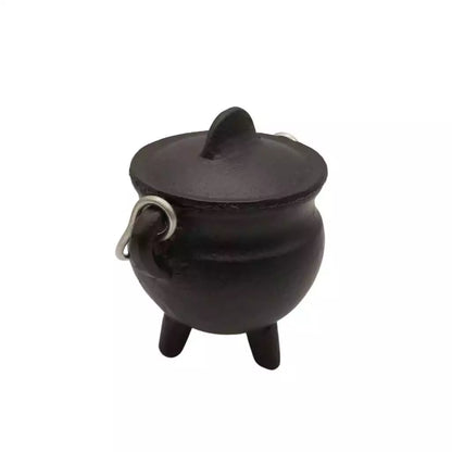 Small black cast iron cauldron with fitted lid, three legs, and a side handle — 2.75-inch mini ritual burning pot for altar use.