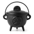 Tree of Life cast iron cauldron with lid and handle — 5-inch black iron cauldron on three legs showing the embossed Tree of Life design on the lid.