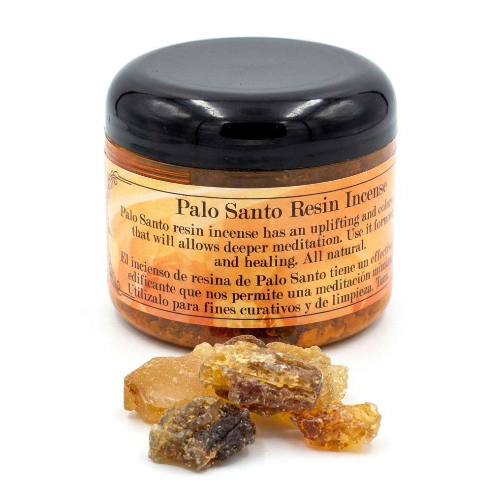 2oz jar of palo santo granular resin incense with loose resin pieces scattered beside it, for use on charcoal discs in ritual burning.