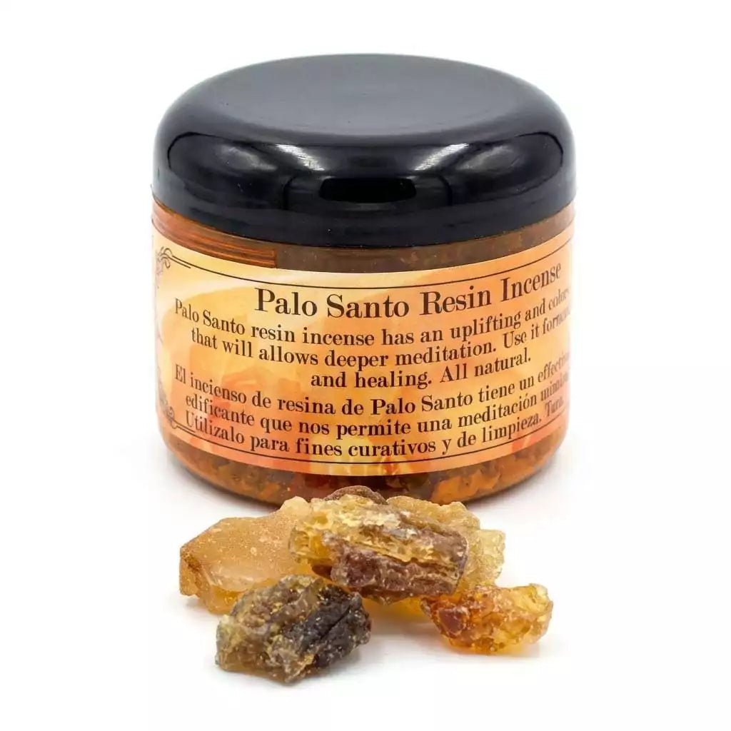 2oz jar of palo santo granular resin incense with loose resin pieces scattered beside it, for use on charcoal discs in ritual burning.
