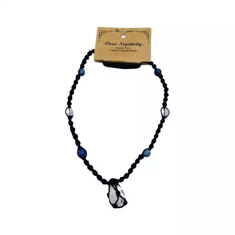 Harmonia beaded necklace with mixed colored beads and a central crystal pendant displayed on a card describing its clearing purpose.