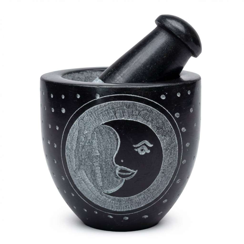 Black soapstone mortar and pestle with a carved moon face motif and dotted textured surface — 2.75-inch ritual herb grinding set.