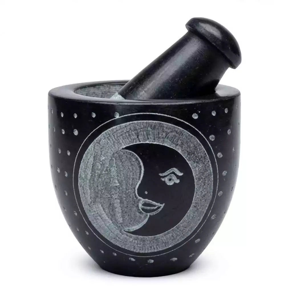 Black soapstone mortar and pestle with a carved moon face motif and dotted textured surface — 2.75-inch ritual herb grinding set.