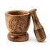 Wooden mortar and pestle with carved pentagram design on the exterior — natural mango wood finish with sturdy round base and tapered pestle.