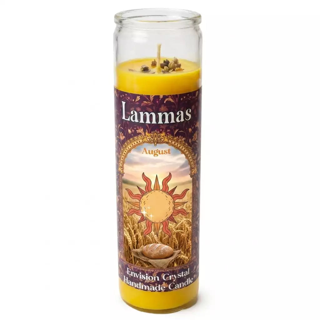 Tall yellow Lammas aromatic jar candle by Envision Crystal, featuring a sun design and floral patterns on the label, encased in a clear glass holder — handmade sabbat candle for Lughnasadh ritual.