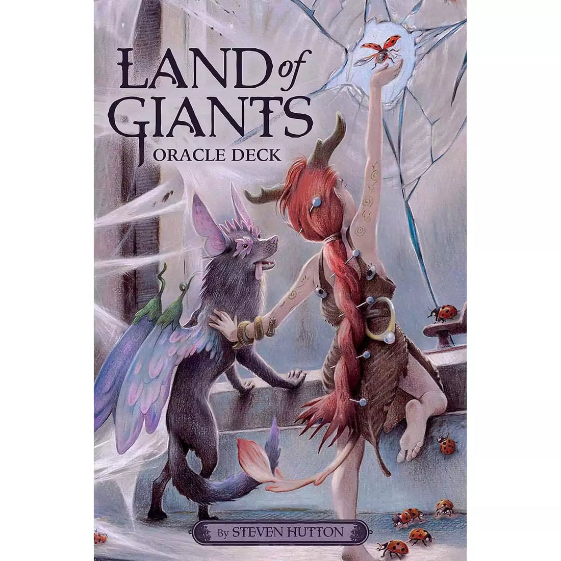 Land of Giants Oracle deck cover showing two small fairy folk, one with wings, in an abandoned manor with spider webs and ladybugs, one reaching toward a butterfly against a cracked window, by Steven Hutton.
