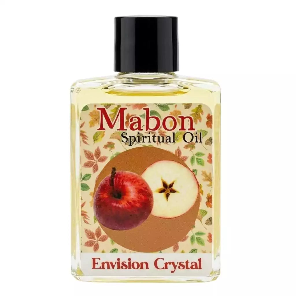 Mabon 4 dram spiritual oil bottle from Envision Crystal — red apple and autumn floral label, brand name visible. Used for autumn equinox candle anointing, personal wear, and ritual.