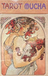 Tarot Mucha Art Nouveau deck cover illustration — woman adorned with flowers and fruit holding grapes, &