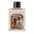 Small 4-dram bottle of Kiss Me Quick ritual oil by Envision Crystal with a romantic couple illustration label, for love-drawing candle and mojo bag anointing.