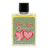 Small bottle of True Love spiritual anointing oil with green label adorned with pink hearts and cherubs and black cap by Envision Crystal for love rituals