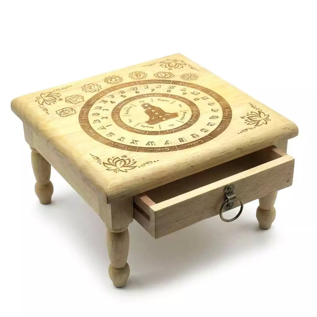 11.5-inch engraved wooden pendulum altar table with circular symbolic design, numbers, and a small storage drawer below for keeping divination tools and crystals.