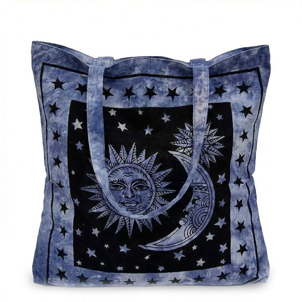 Sun and Moon Tote Bag — blue canvas carry-all with celestial illustrated sun and moon surrounded by stars for witchy daily use and spiritual supply toting.