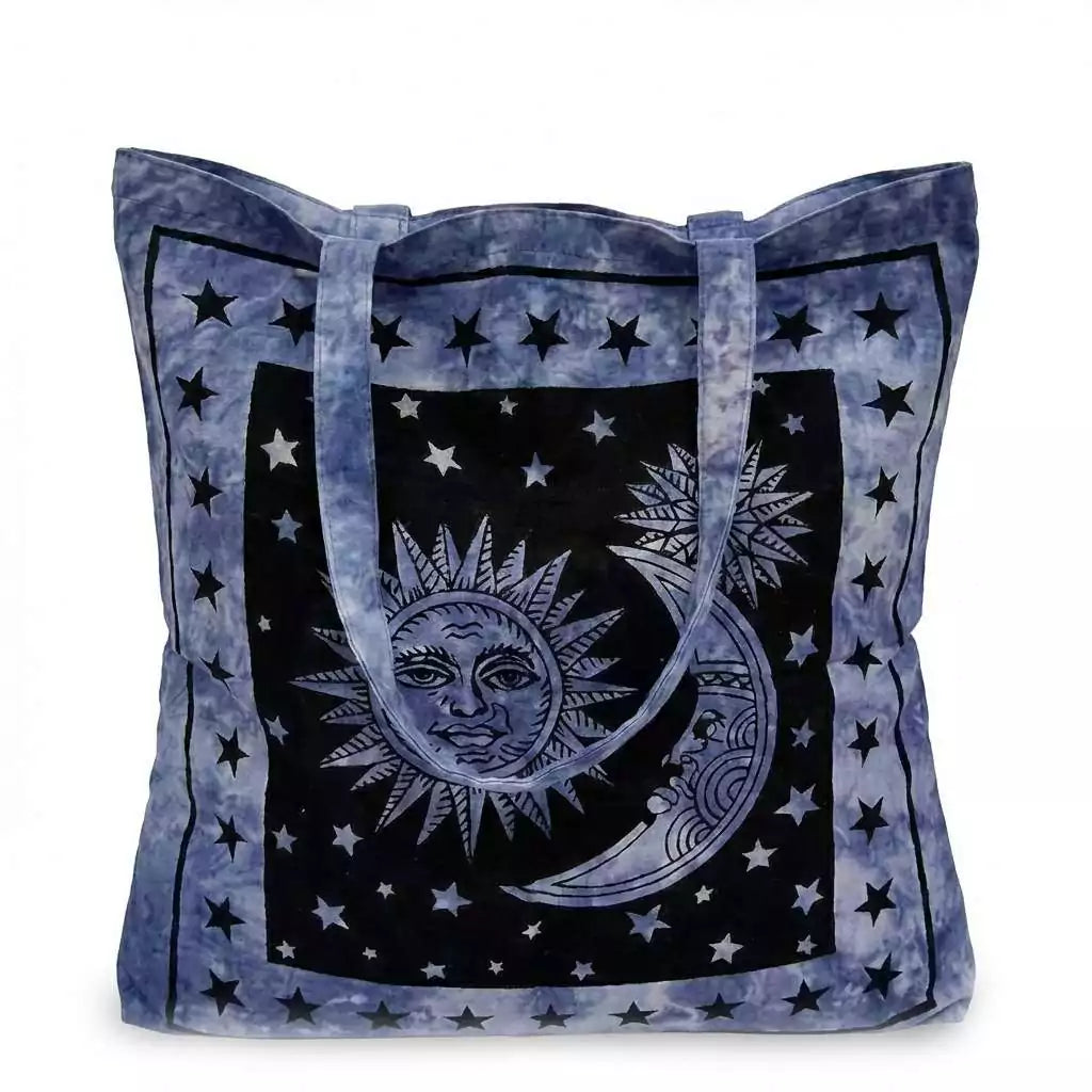 Sun and Moon Tote Bag — blue canvas carry-all with celestial illustrated sun and moon surrounded by stars for witchy daily use and spiritual supply toting.