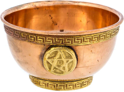 A decorative copper bowl featuring a gold-colored pentagram emblem and a geometric border design. The interior is polished, highlighting its metallic finish.