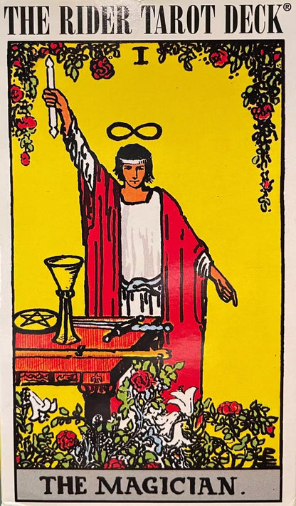 Rider-Waite Tarot Magician card showing a robed figure with one arm raised holding a wand above an altar bearing the four suit symbols.
