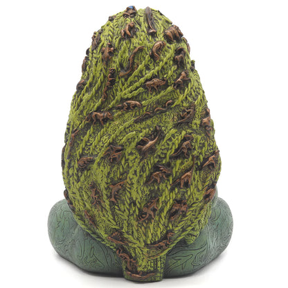 Textured green sculptural base of Millennial Gaia statue by Oberon Zell showing rocky earth and nature details beneath the seated goddess figure.