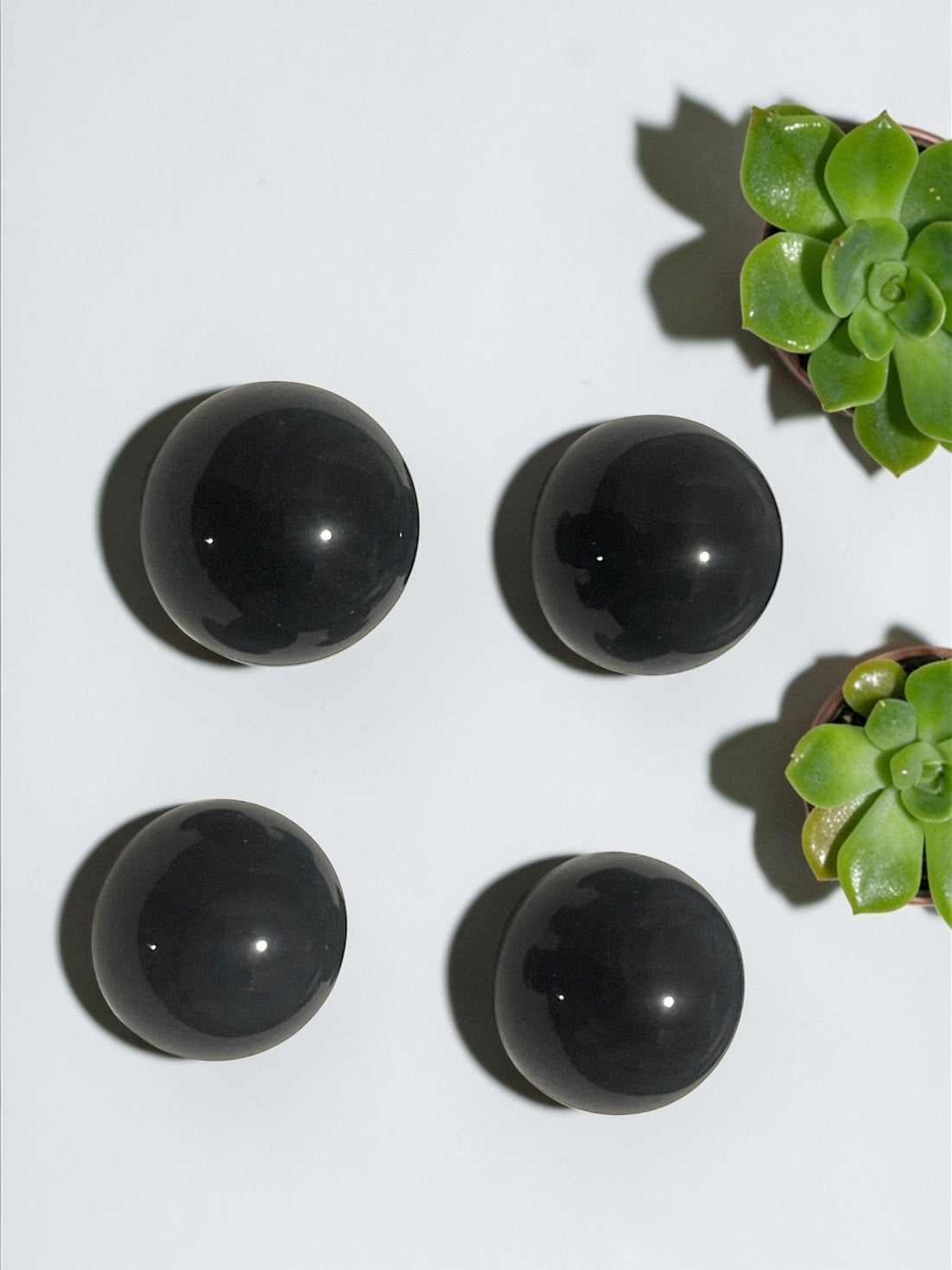 Black obsidian cat eye sphere