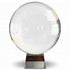 A large 200mm clear crystal ball on a metallic display stand reflecting light and creating visual distortions — an 8-inch polished quartz sphere for scrying, meditation, and altar display.