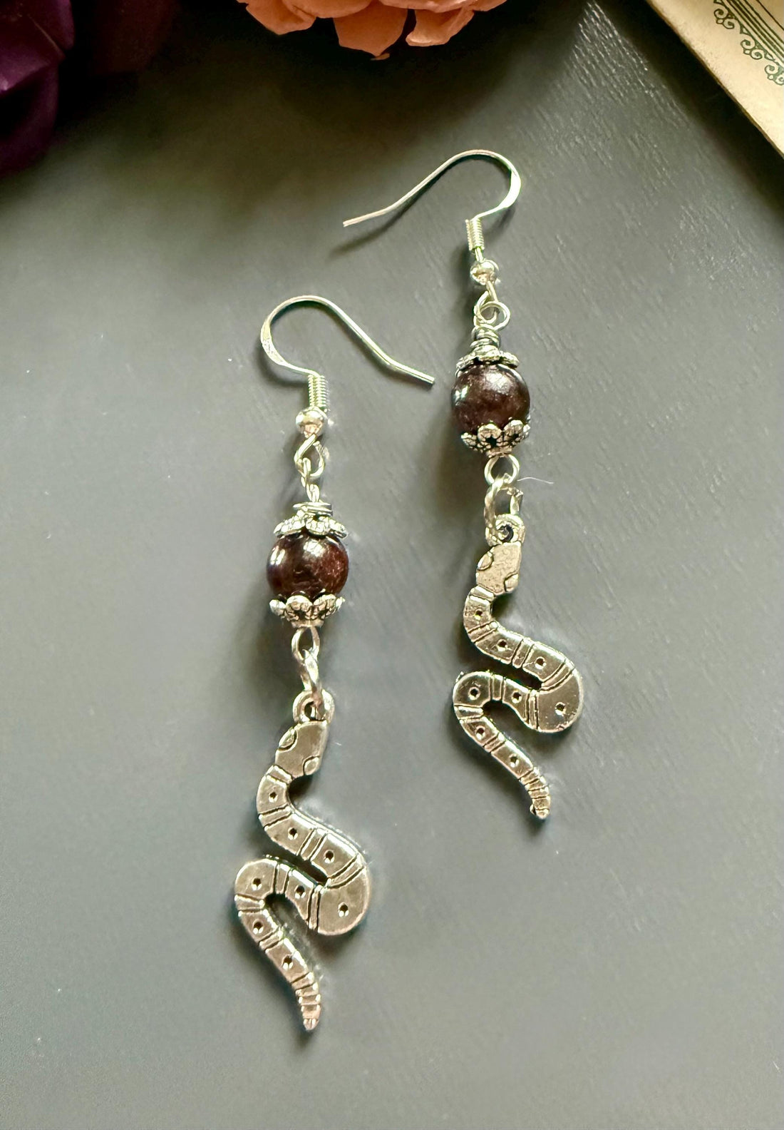 Lilith Serpent Earrings: Garnet Gemstone and Silver Snake Charms.