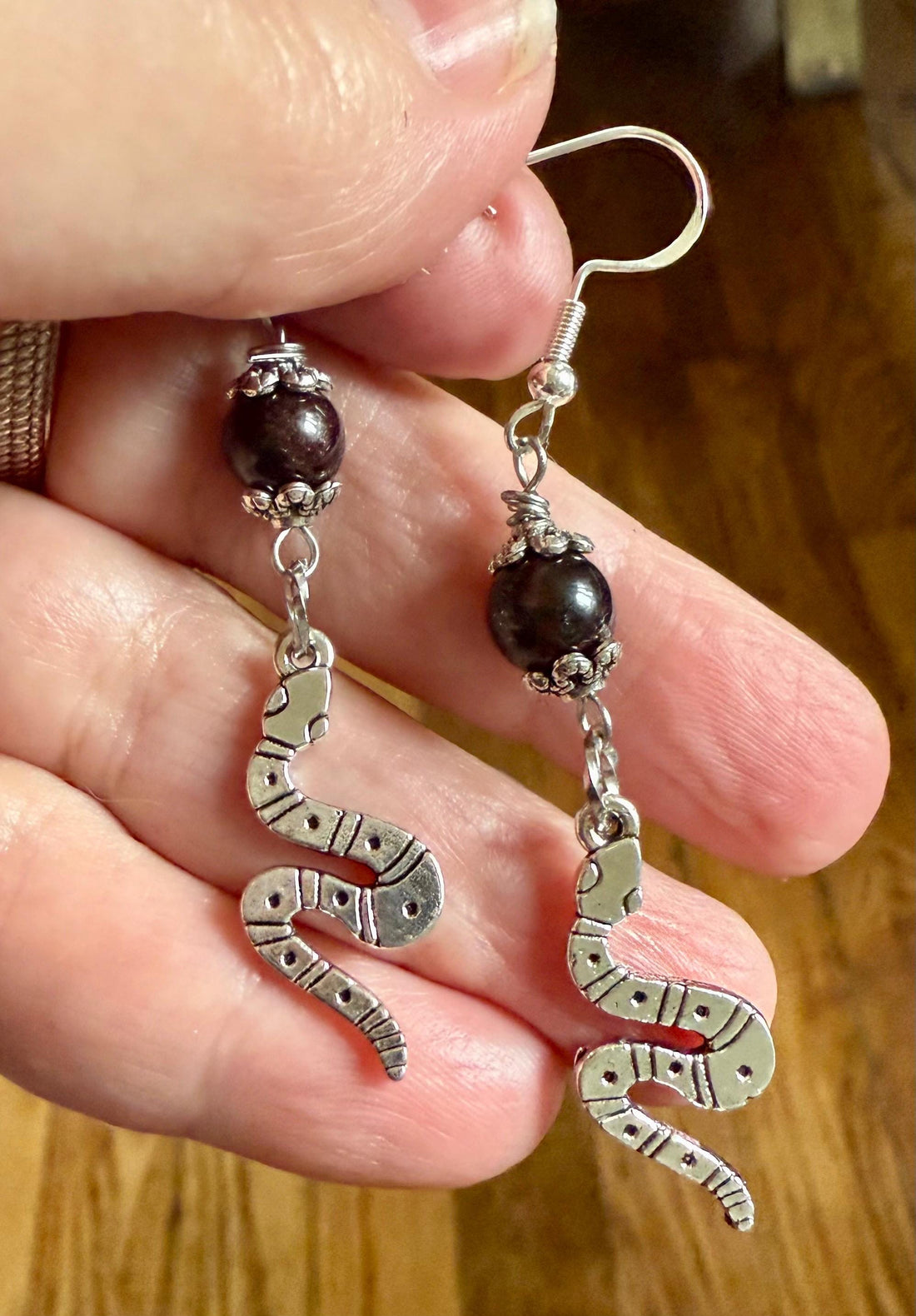 Lilith Serpent Earrings: Garnet Gemstone and Silver Snake Charms.