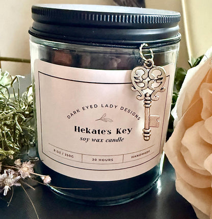 Goddess Hekate Black Soy Candle with Key Charm, Herbs, and Amethyst Crystal Chips.