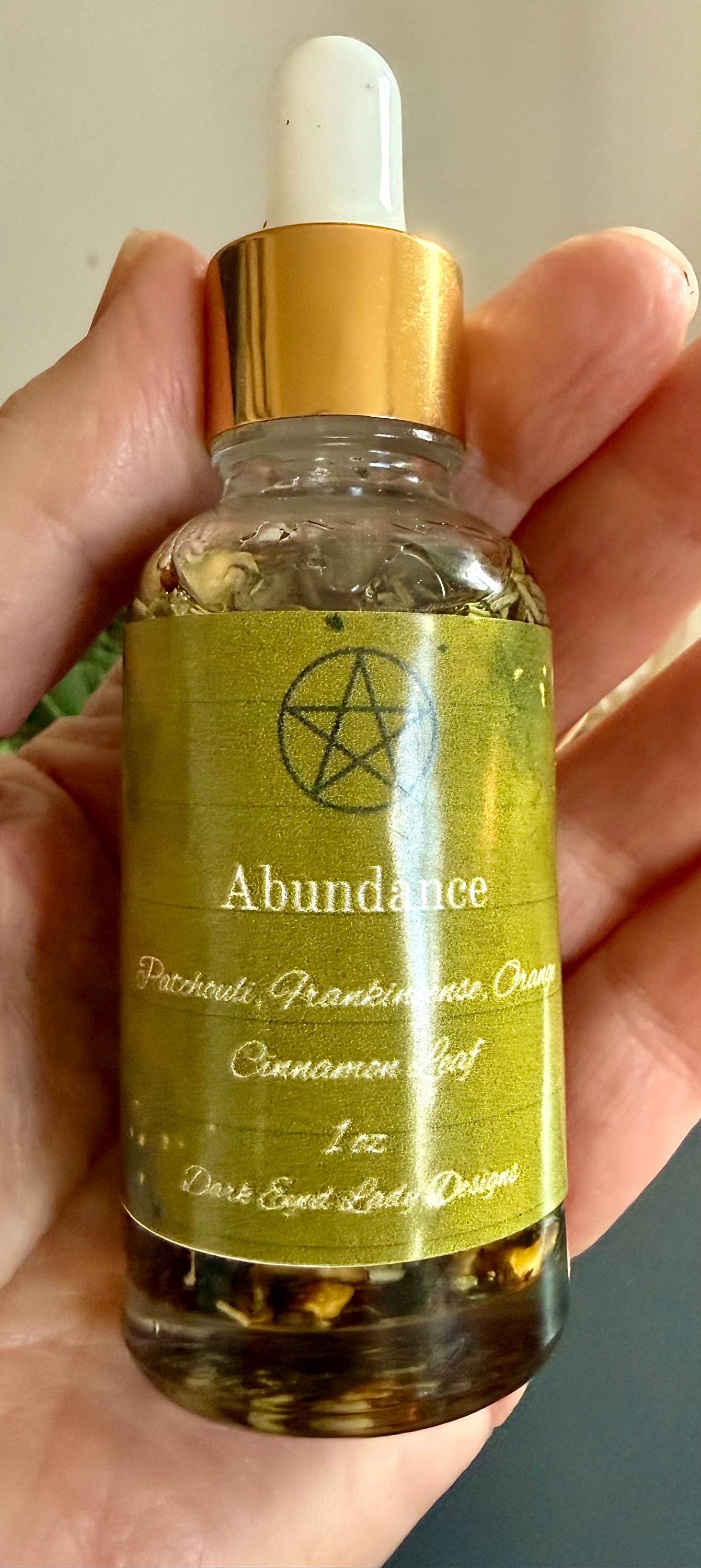 Abundance Ritual Anointing Oil with Essential Oils and Herbs.