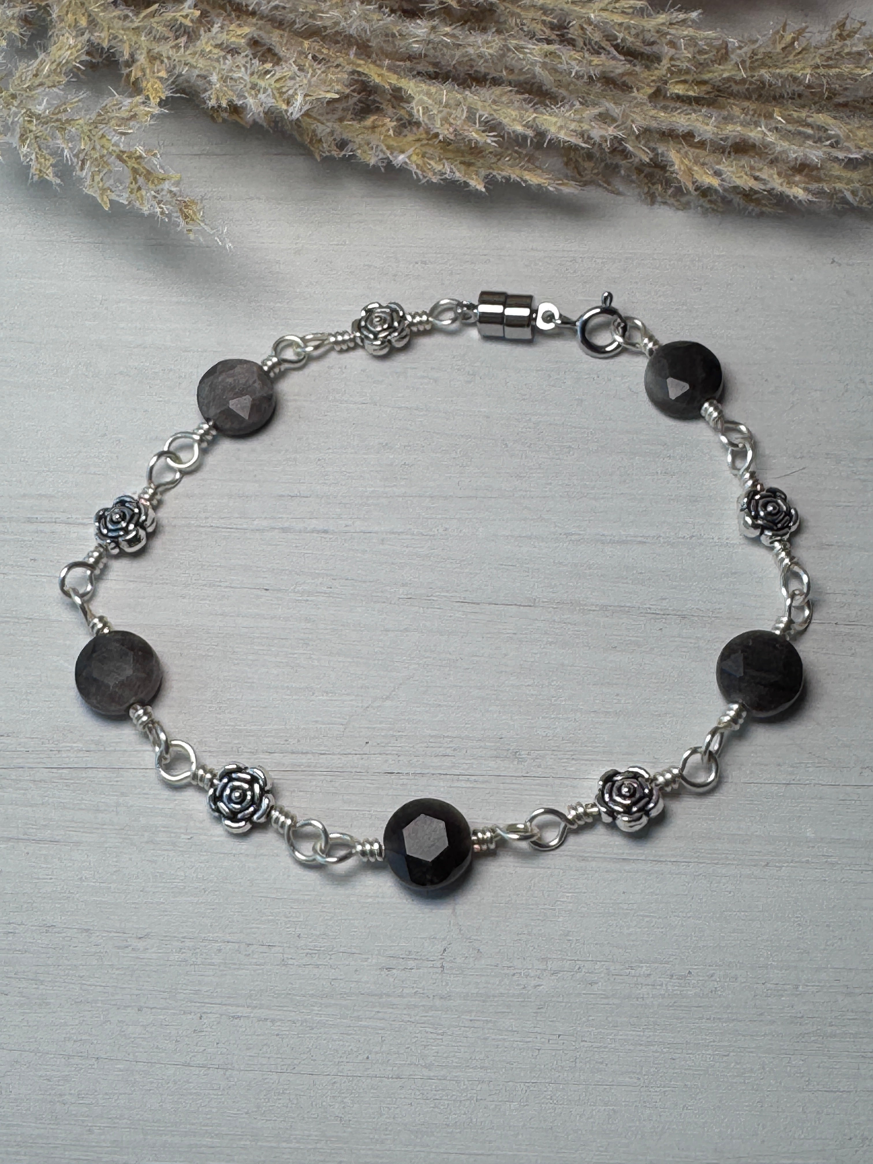 Silver Wire Wrapped Bracelet with Silver Obsidian Gemstones and flower charms.