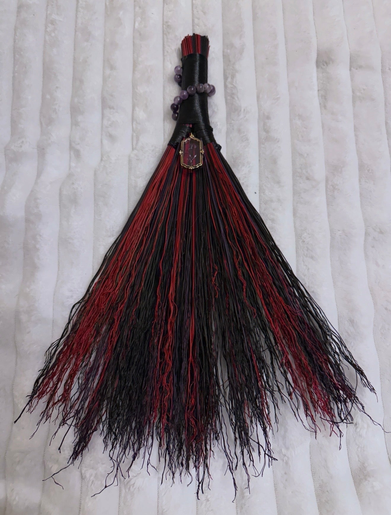 Carved charm broom
