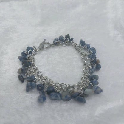 8in Sodalite chip bracelet with blue and white stones on a silver stainless steel chain.