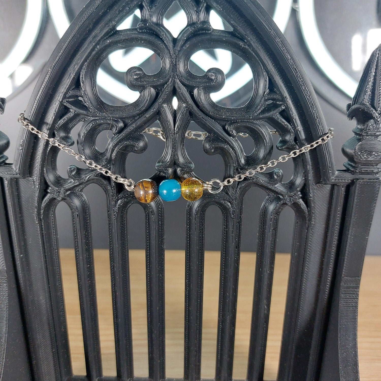 Silver-tone Gemini power stone bracelet with tiger&