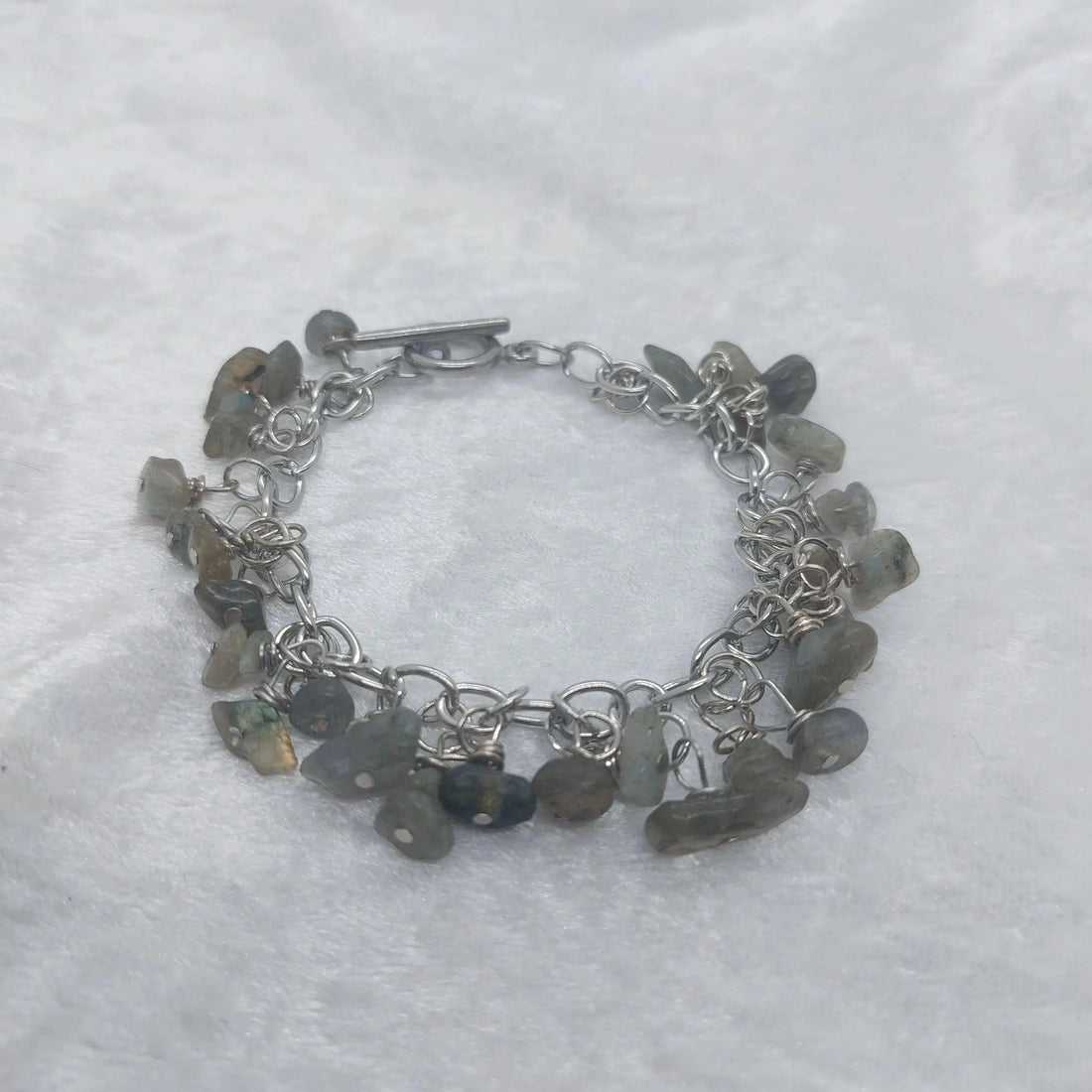 Labradorite chip bracelet with iridescent gray stones on a silver chain and toggle clasp.