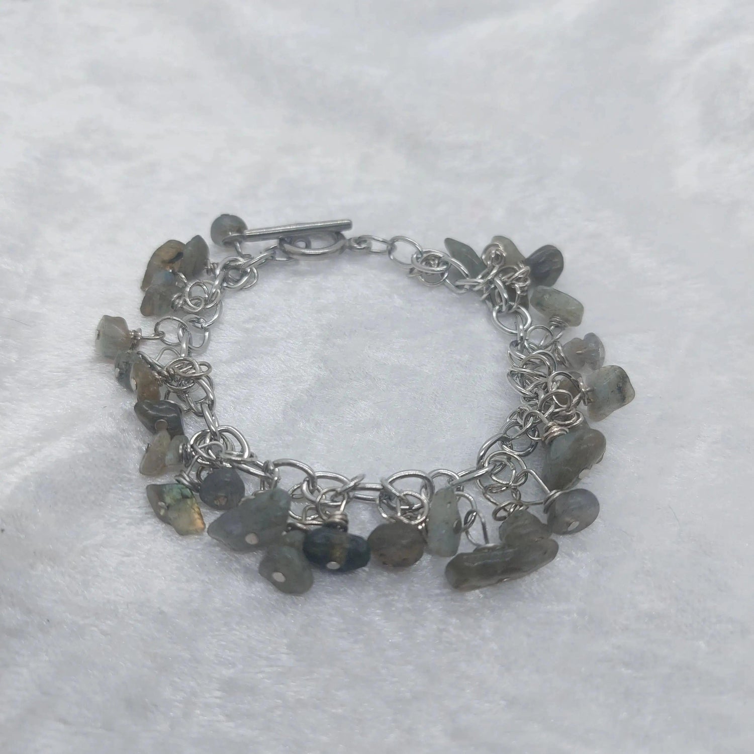 Labradorite chip bracelet with iridescent gray stones on a silver chain and toggle clasp.