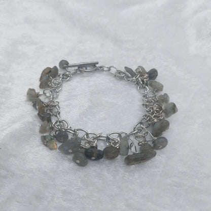 Labradorite chip bracelet with iridescent gray stones on a silver chain and toggle clasp.