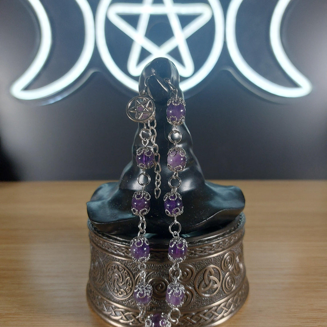 Amethyst crystal beaded bracelet with stainless steel findings, bead caps, and a pentagram charm.
