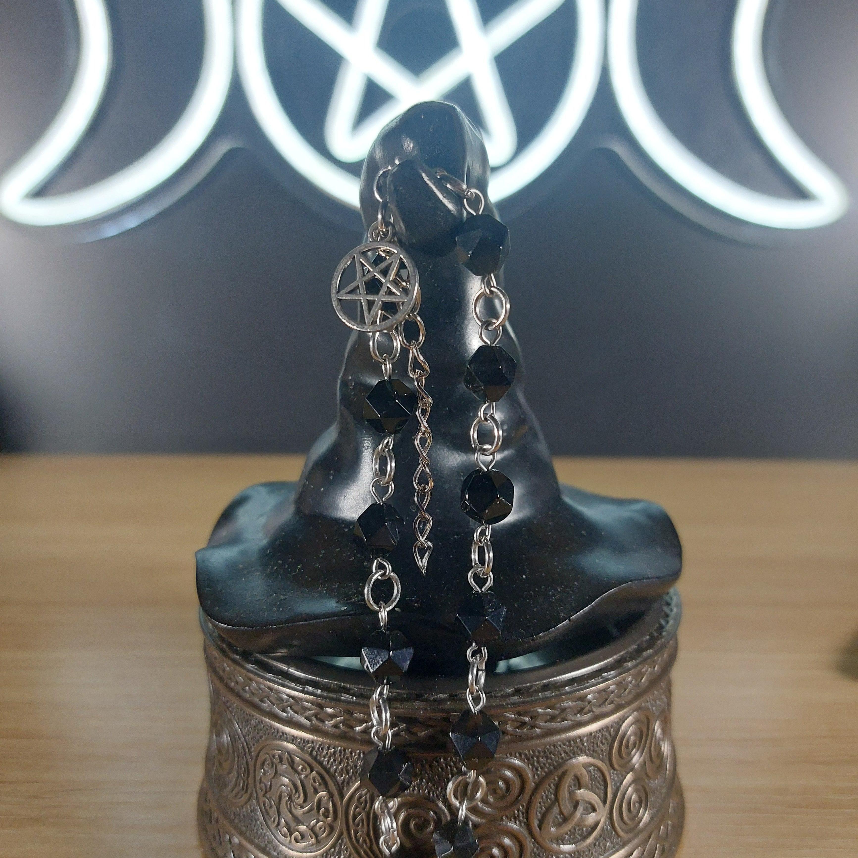 Black onyx faceted crystal bracelet with silver pentagram charm and stainless steel findings.